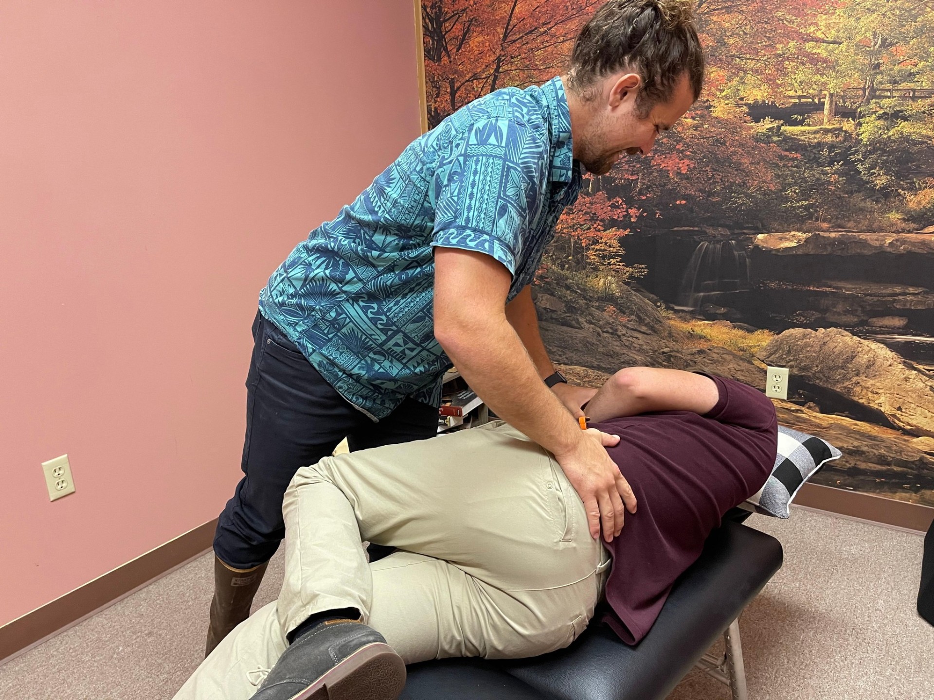Dr. Derek Larsen performing a chiropractic adjustment in Juneau